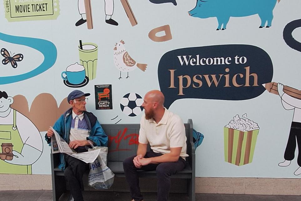 At Ipswich’s Buttermarket shopping centre, a new initiative is making a big difference: the installation of a “Chatty Bench.”